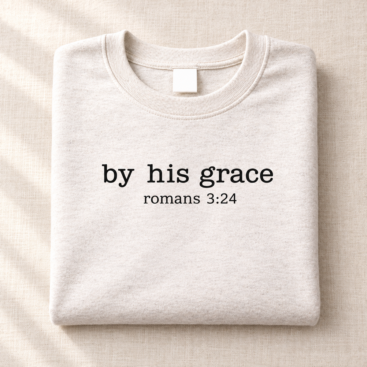 By His Grace crewneck folded