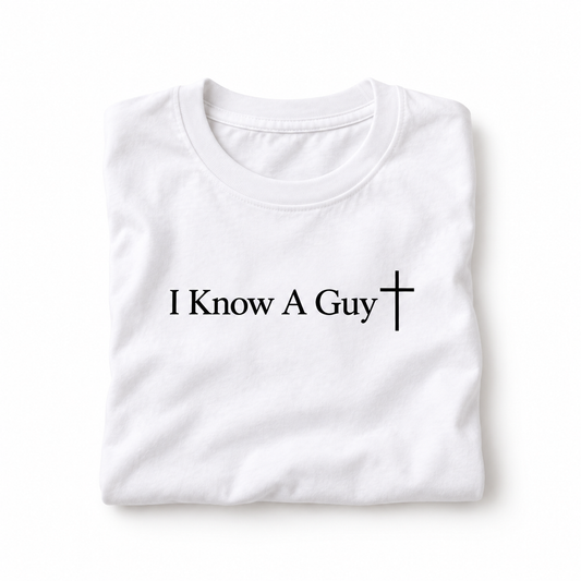 White I Know A Guy tee folded with black lettering and cross
